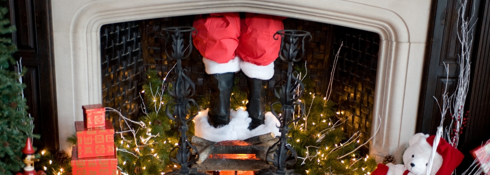 Father Christmas feet in fireplace